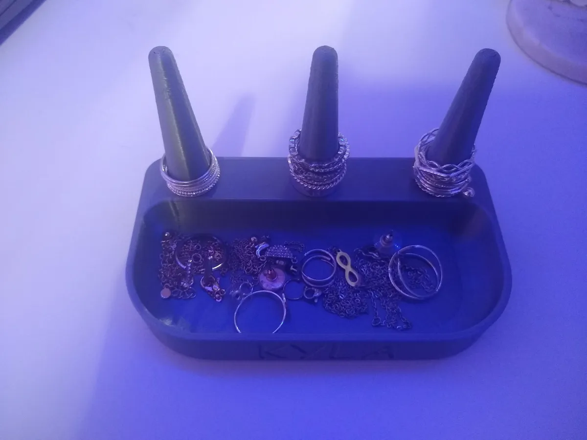 Another view of the charcoal jewelry organizer in use with rings and loose jewelry.