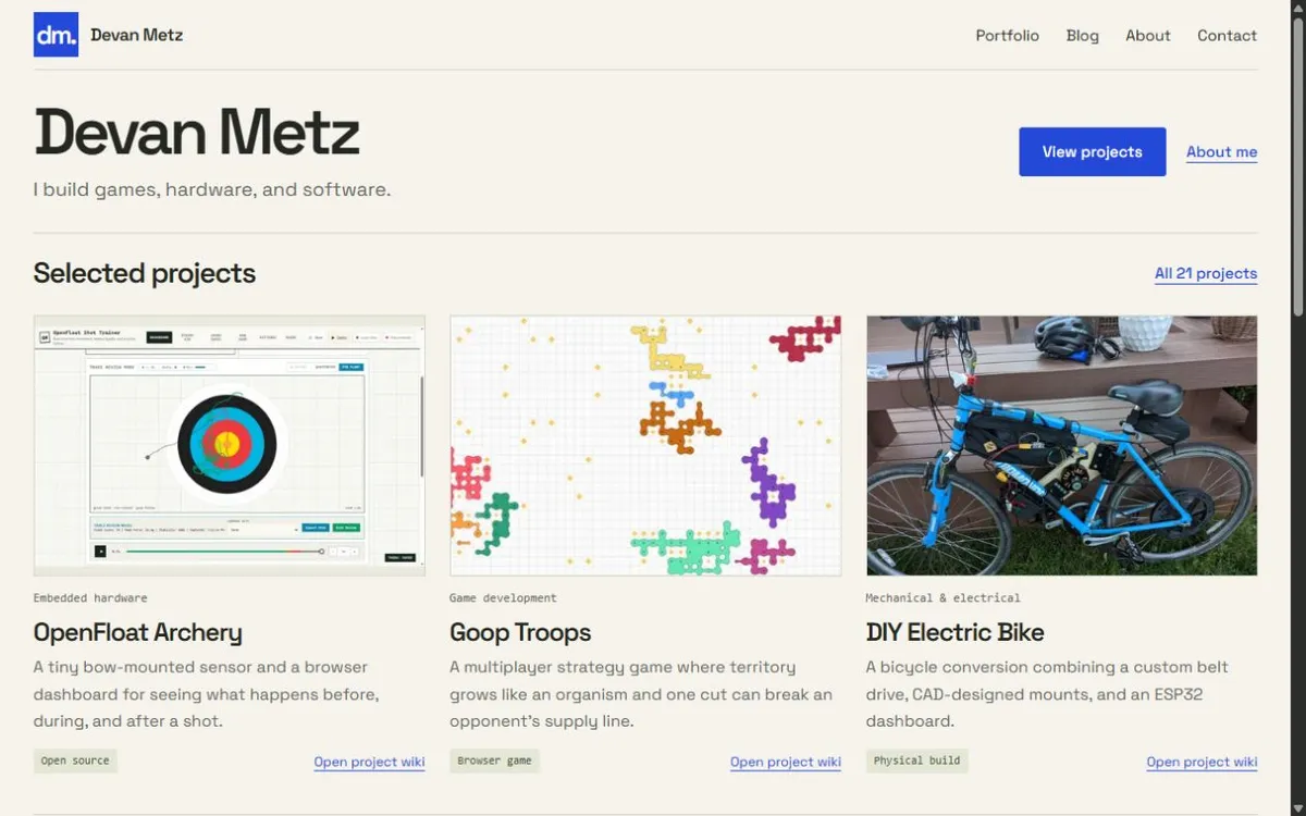 The devanmetz.com homepage with picture cards for OpenFloat Archery, Goop Troops, and a custom electric bicycle.